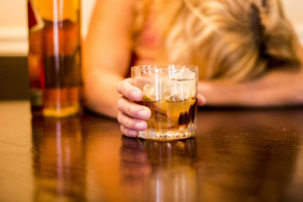 Person holding a glass of alcohol. alcohol and lorazepam, ativan for alcohol withdrawal, ativan and alcohol reactions, Effects of Drinking on Ativan, how long after taking ativan can i drink alcohol