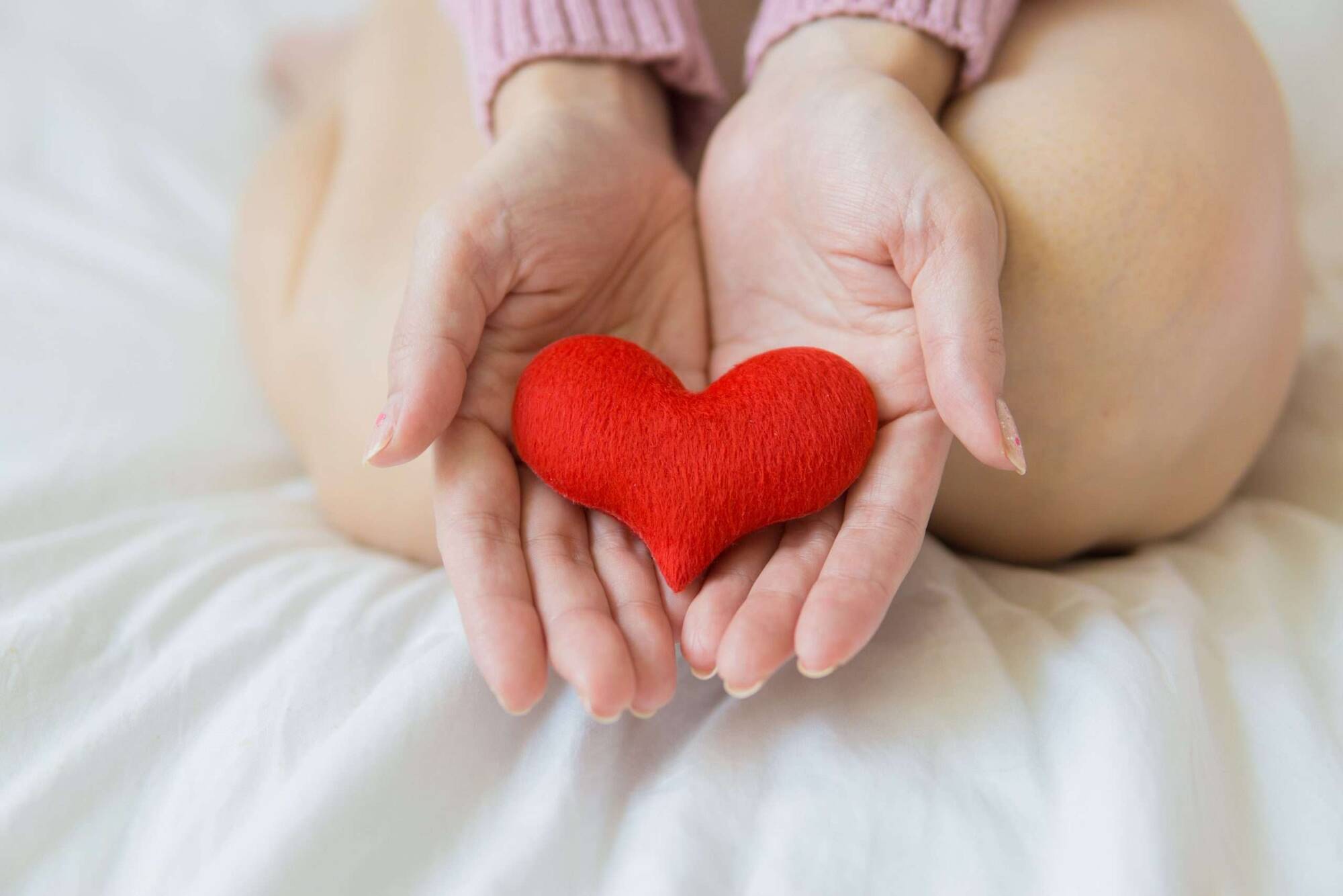 Crop woman with heart on palms. How to Get Someone Mental Help When They Refuse in Ontario
