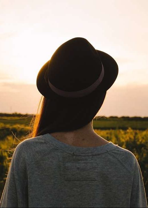 woman overlooking a field, Benefits of Seeking Mental Health Treatment