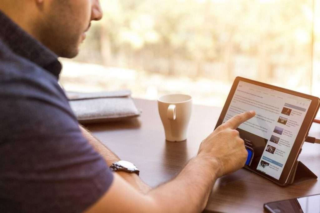 Person using tablet, how does internet addiction affect mental health