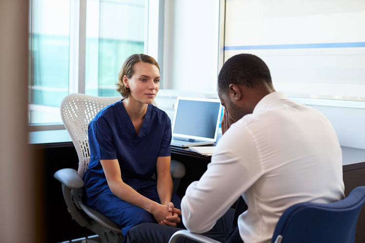 Psychiatrist helping client at inpatient treatment centre