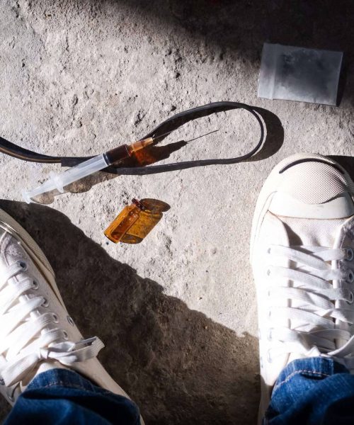 Ketamine with syringe on the ground. Ketamine Addiction, Is ketamine addictive, What is ketamine, Effects of ketamine, Ketamine effects, Overdose of ketamine, Withdrawal from ketamine, Ketamine detox, Ketamine Addiction Treatment